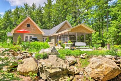 Calm Waterfront Great Pond Cottage with Hot Tub Deck - image 10