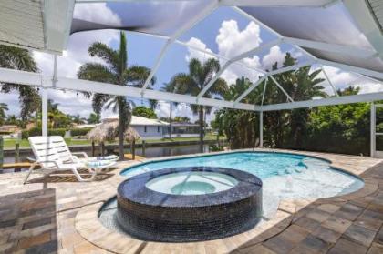 Half mile to the beach Heated Pool  Spa with tiki on boat dock   Villa Changes in Attitude Florida