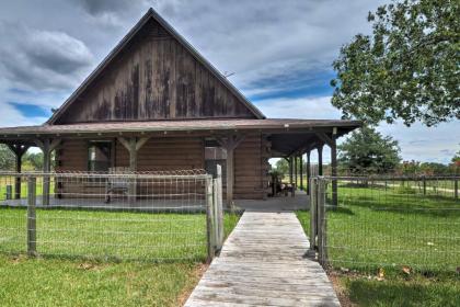 Rustic Carmine Log Cabin with Covered Porch on Farm! - image 3