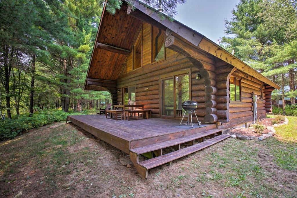 Secluded Log Cabin in NW Michigan with Fire Pit and Deck - main image