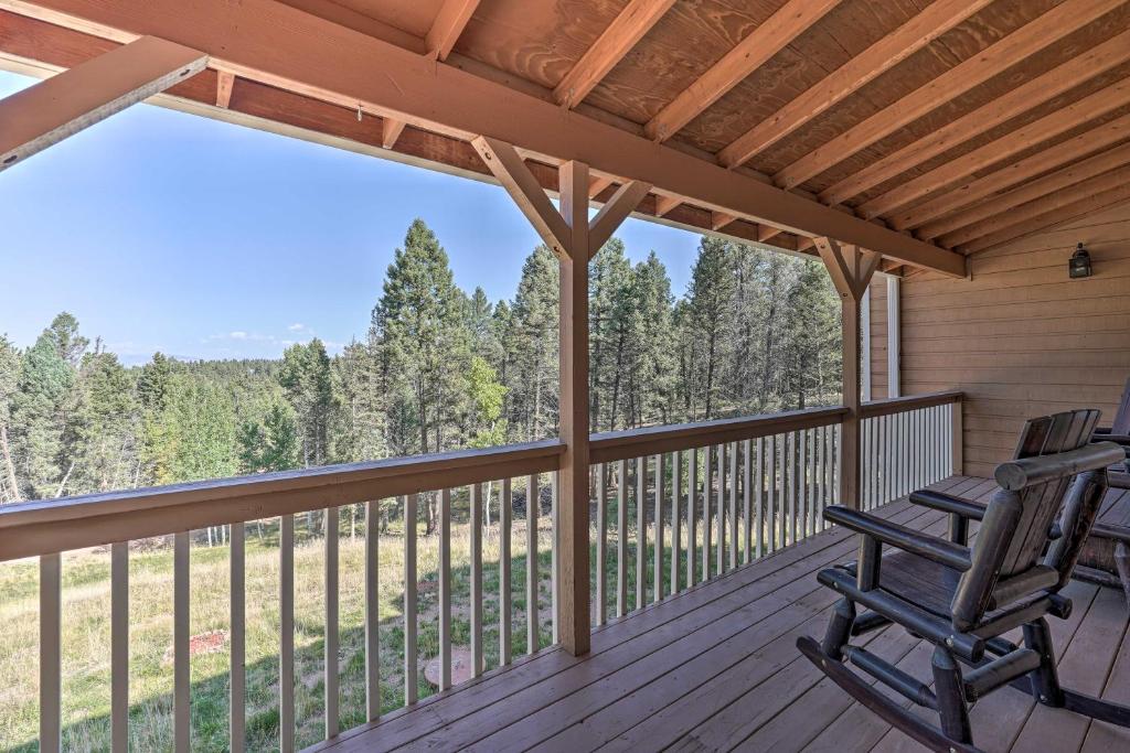 Hilltop Haven with Wraparound Deck and Peak Views - main image