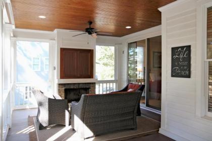 Enjoy our outdoor Tv and screened porch at Marina Cottage - image 7