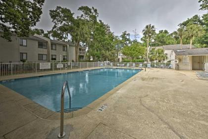 Beach Condo with Pool Access and Porch about half Mi to Shore! - image 10