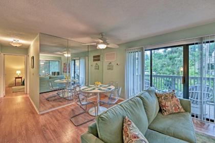 Beach Condo with Pool Access and Porch about half Mi to Shore! - image 4