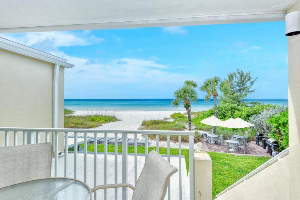 LaPlaya 201C Breathtaking Gulf panorama from this corner end unit with a private stairway to the beach - image 3