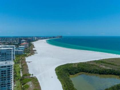 NEW OWNERS! End Unit w/ Top of Line Finishes / Wide Gulf Views! - image 4