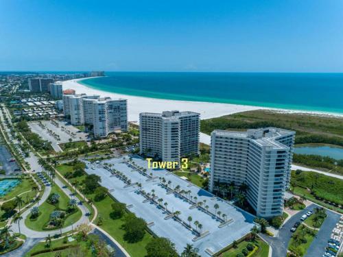 NEW OWNERS! End Unit w/ Top of Line Finishes / Wide Gulf Views! - image 5