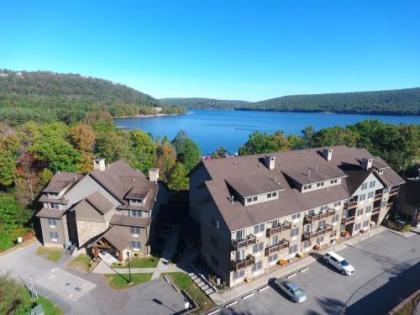 A125 - Studio Suite with Lake View End Unit with Private Balcony Cozy Fireplace!