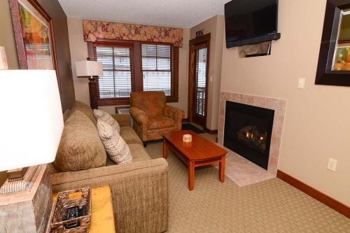 A208- One bedroom suite standard view with a cozy fireplace! - main image