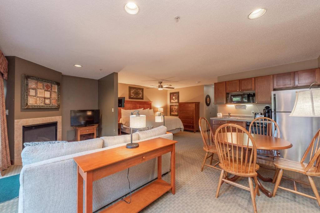 A125 - Studio Suite with Lake View End Unit with Private Balcony Cozy Fireplace! - main image