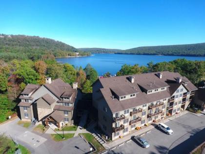 A125 - Studio Suite with Lake View End Unit with Private Balcony Cozy Fireplace! - image 2