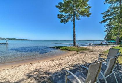 modern torch Lake Cottage with Dock and Fire Pit Michigan