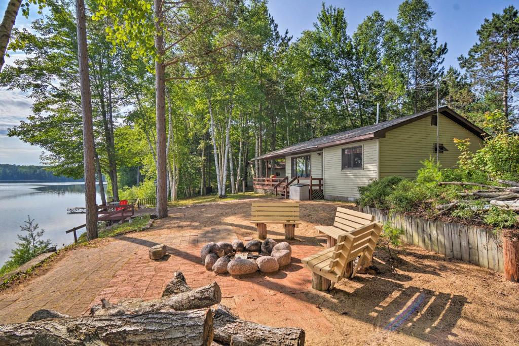 Lakefront Manistique Cabin with Private Dock and Fire Pit - main image