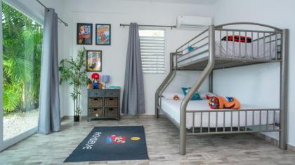 Two-bedroom suite decorated with video game theme - image 13