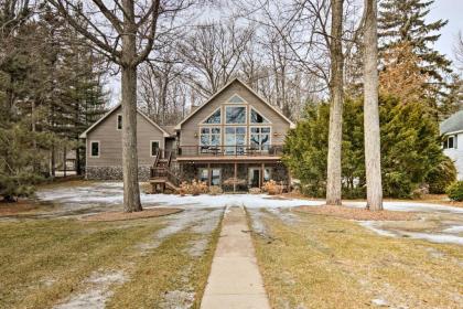 Lakefront Roscommon Home with Dock Patio and Games! - image 10