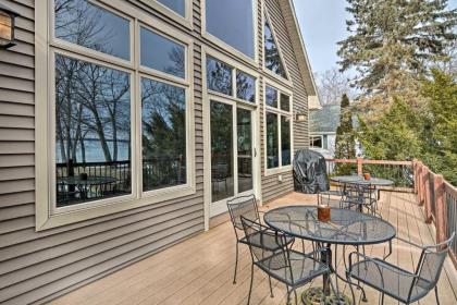 Lakefront Roscommon Home with Dock Patio and Games! - image 12